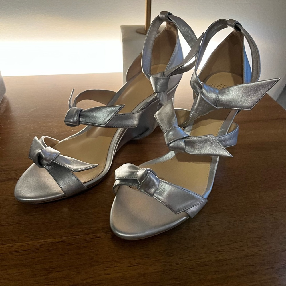 Exquisite silver sandals with 2 1/2” wedge.